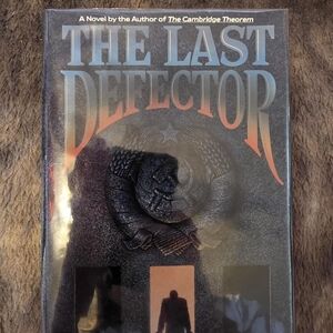 The Last Defector Hardcover Novel - Bold Metallic Title Art